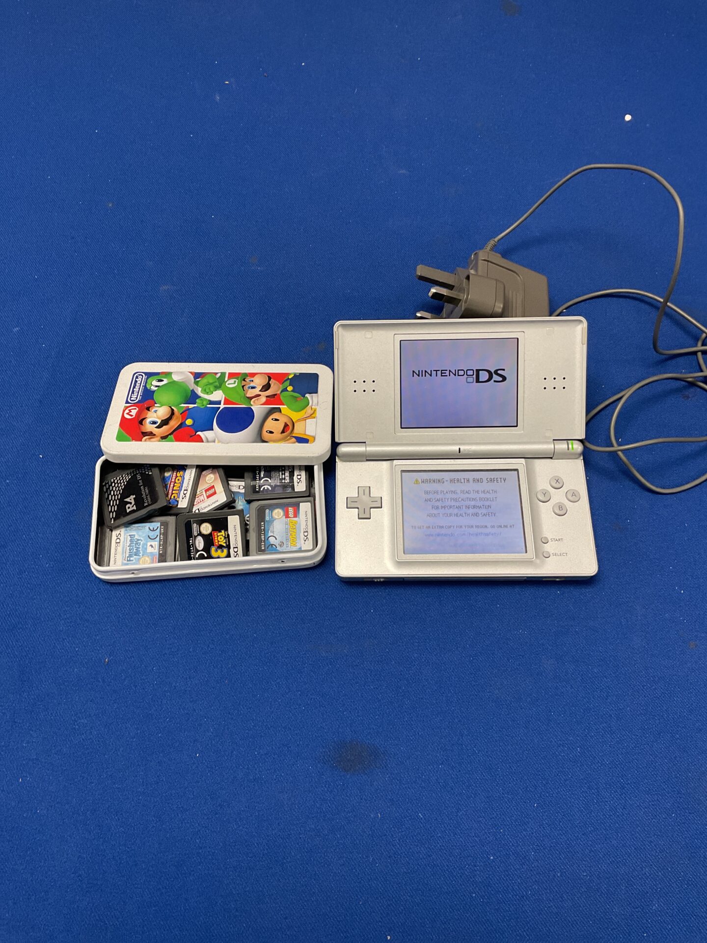 184 Nintendo DS with charger and games incl. sonic, lego batman, lego marvel superheros