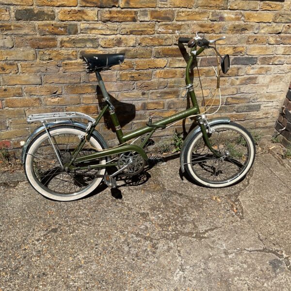 Green vintage Raleigh Twenty folding bicycle, classic retro style.