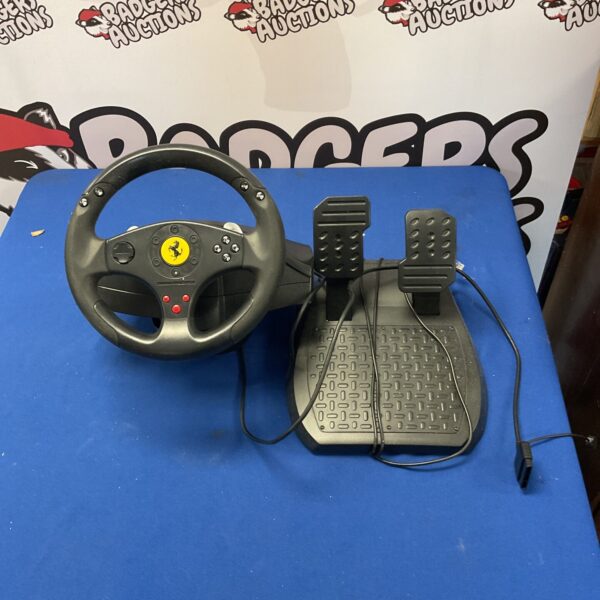 Trustmaster Ferrari racing wheel and pedals for gaming consoles.