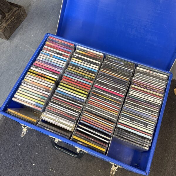 Large transit case filled with a mixed lot of CDs for music lovers.