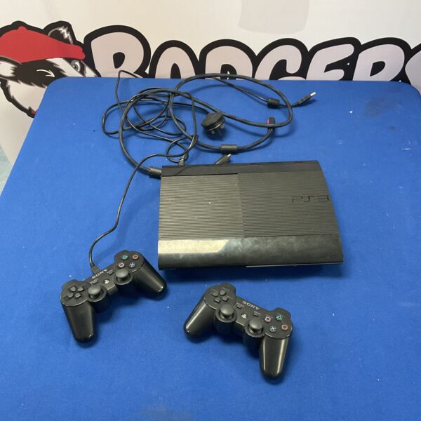 Black Sony PlayStation 3 console with two controllers for gaming.