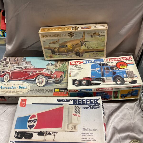 Vintage model kits lot including Monogram Mercedes Benz and Kenworth truck.