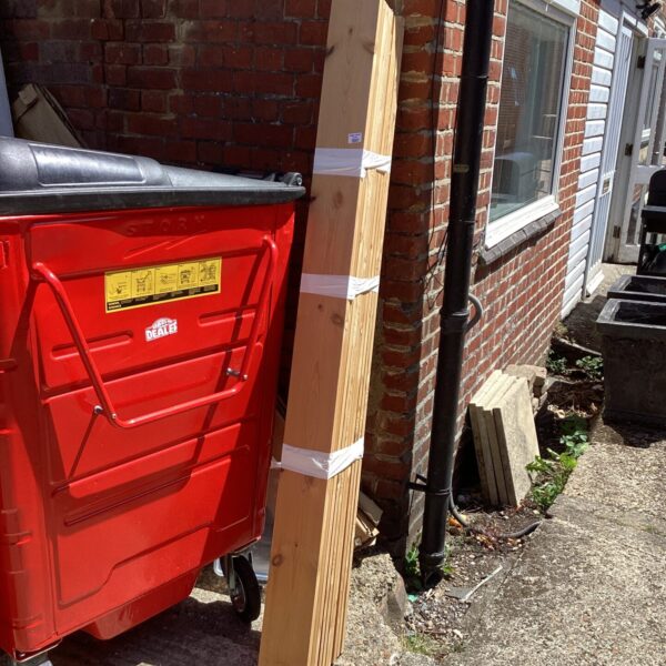 Strapped bundle of softwood timber for DIY projects.