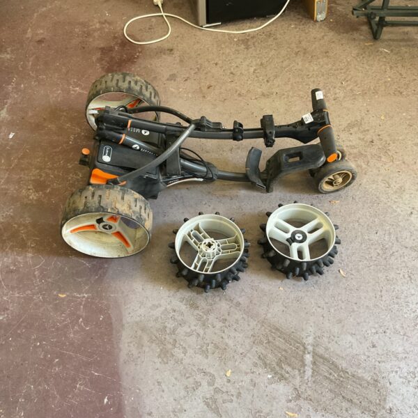 Used Motocaddy electric golf trolley with spare wheels.