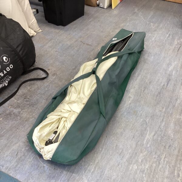 Used telescopic gazebo with carry bag for portable outdoor shelter.