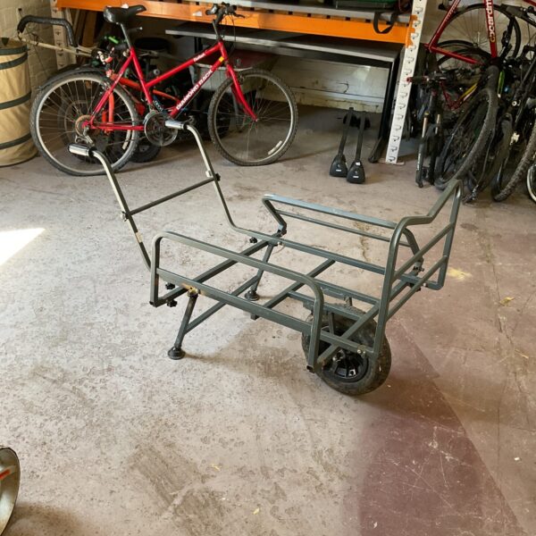 Heavy duty carp fishing barrow with metal frame and large platform.