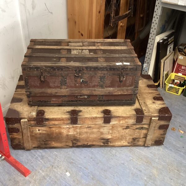 Pair of vintage wooden chests with aged patina.