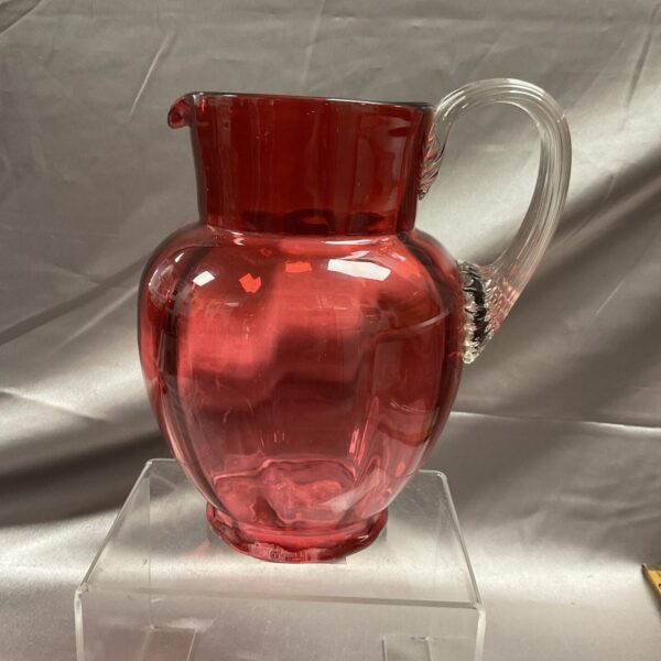 Antique cranberry glass jug, a beautiful vintage red glass pitcher.