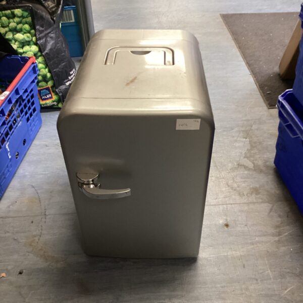 Portable mini fridge with carry handle, compact cooling solution.