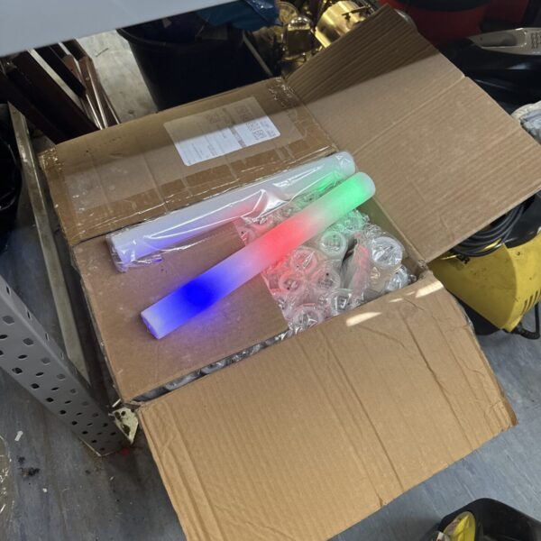 Box of vintage rave glow sticks for parties and events.