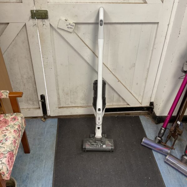 Miele Triflex HX2 vacuum body on a dark surface.