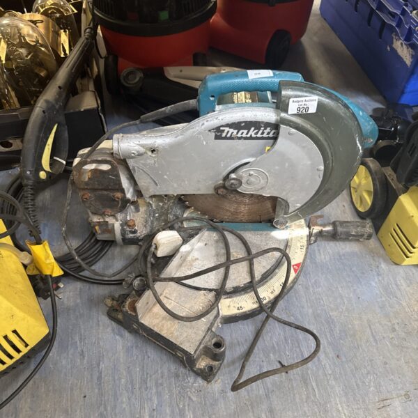 Vintage Makita chop saw for metal cutting in a workshop setting.