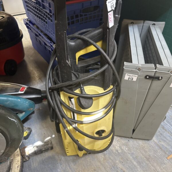 Black Rx510 pressure washer with hose and trigger handle for outdoor cleaning.