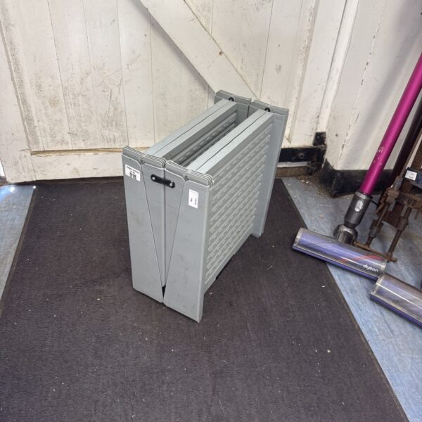 White plastic folding access step for household use.