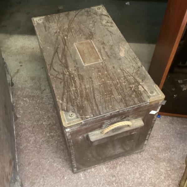 Antique wooden box with brass corners and rope handles.