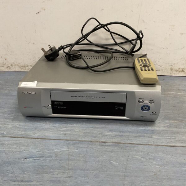 Front view of a Daewoo VCR player with remote control.