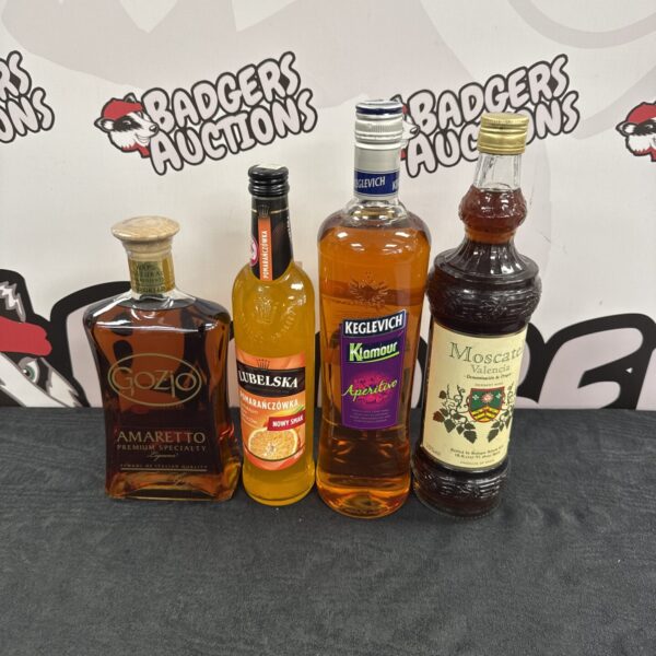 Vintage alcohol bottle lot including Amaretto and Polish Vodka.