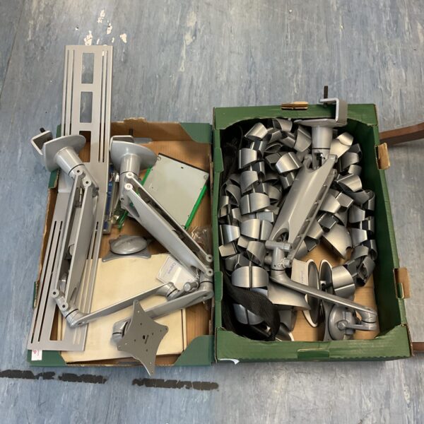Lot of screen mounts and cable tidy for computer setup.