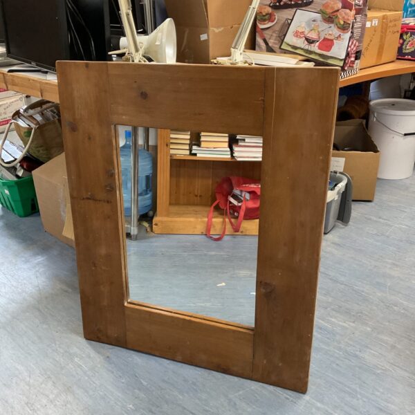 Vintage oak framed mirror for wall decoration.