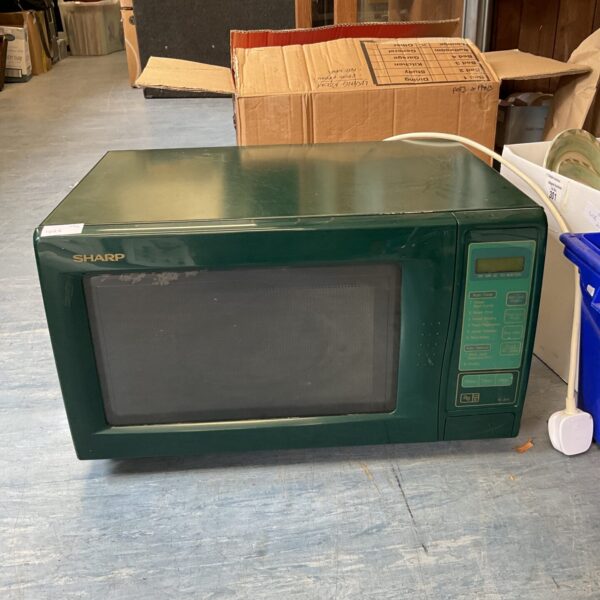Vintage green Sharp R-341 microwave oven, retro kitchen appliance.
