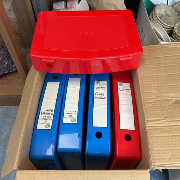 Lot of five colourful plastic box files for document storage.