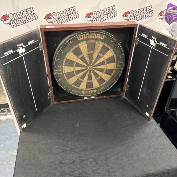 Vintage Winmau dartboard in wooden wall case for games room.