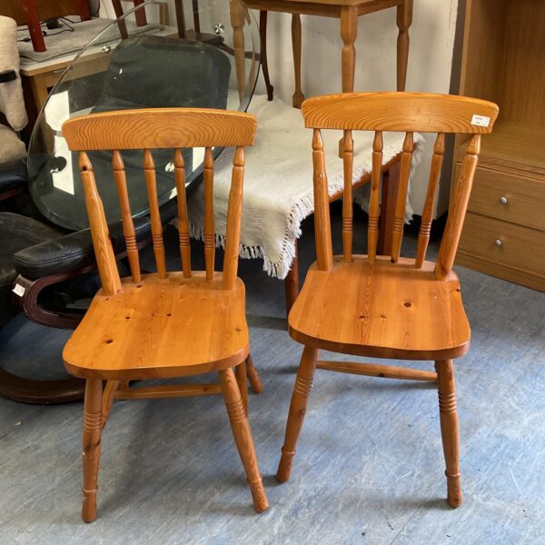 Vintage pine Ducal kitchen chairs with curved back splats.