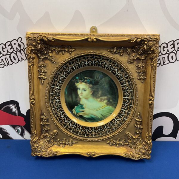 Antique Germanic porcelain plate with a fairy, in a gilt frame.