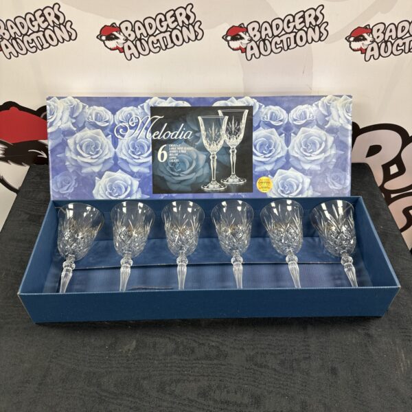Elegant Melodia lead crystal wine glass set on display.