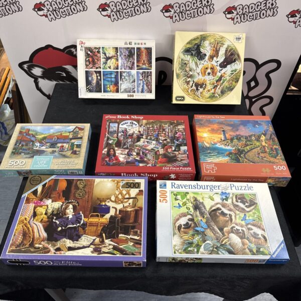 Assorted jigsaw puzzles lot including Falcon and Ravensburger brands.