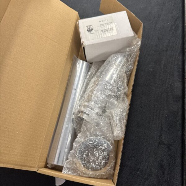 Chrome bottle trap set in original packaging, ready for installation.