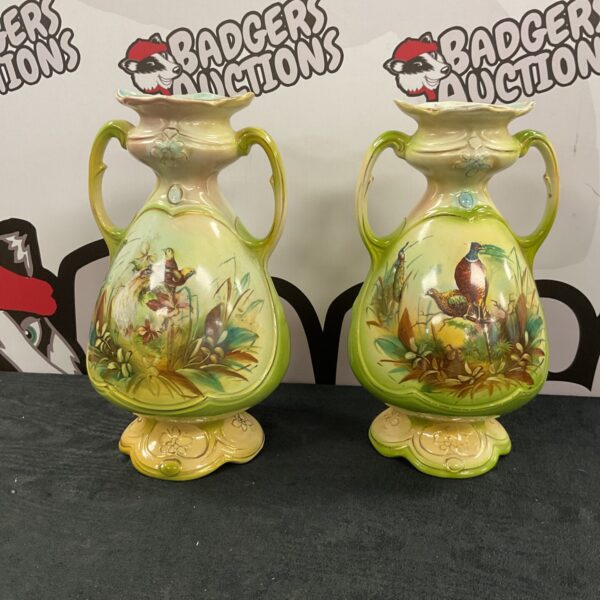 Antique Royal Vienna art pottery vases with bird designs.