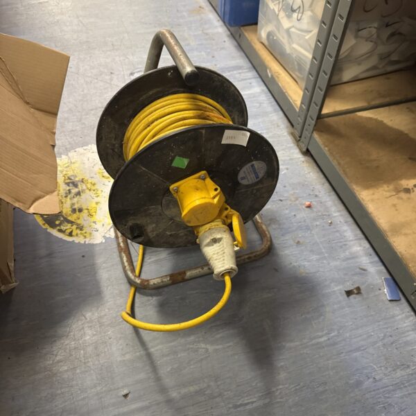 Yellow 110v two gang extension reel for portable power.