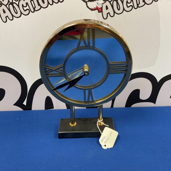 Vintage Ramaj marble mantle clock with brass pillar.