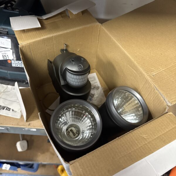 Unused twin head outdoor security light for garden or home.