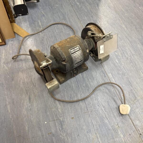 Vintage Black & Decker P7505 bench grinder in used condition.