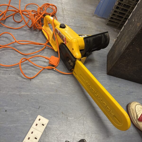 Yellow McCulloch Electramac 14” electric chainsaw for garden use.