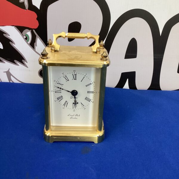 Vintage Lionel Peck quartz carriage clock with brass case.