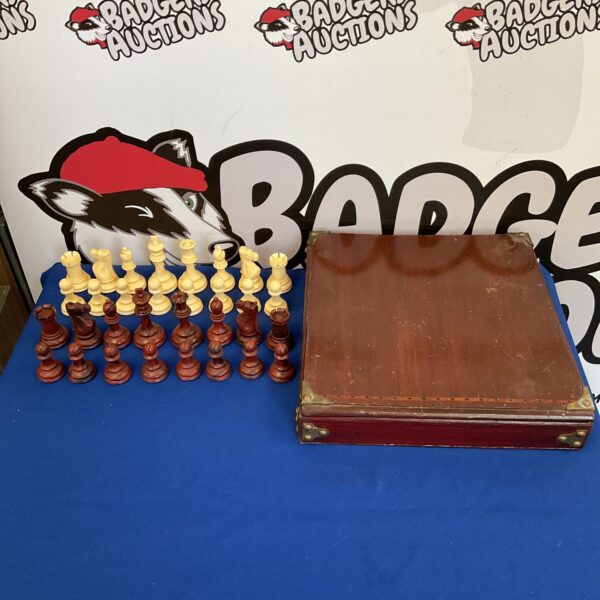 Vintage wooden chess set with complete chessmen.