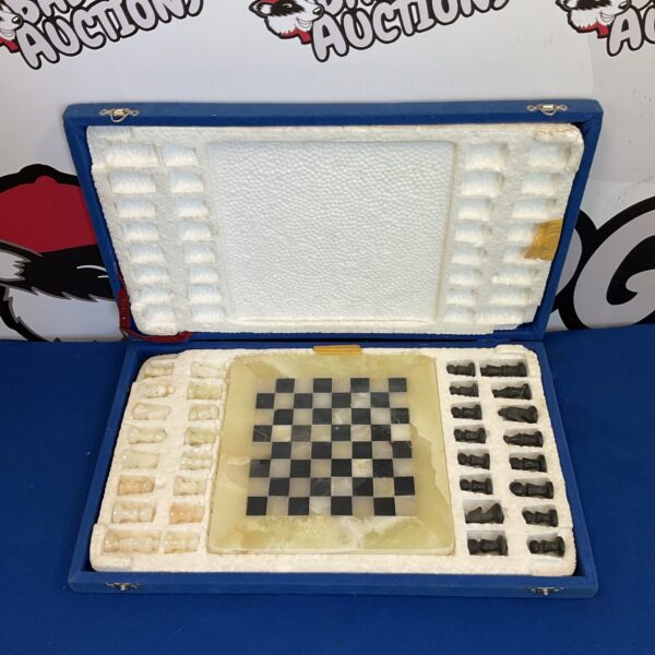 Vintage marble chess set in a portable case, collectible board game.