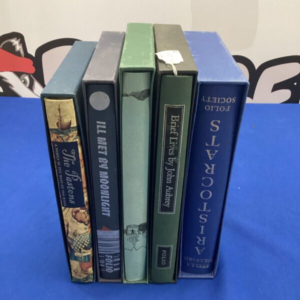 Folio Society book collection featuring 'Aristocrats' and 'Ill Met by Moonlight'.
