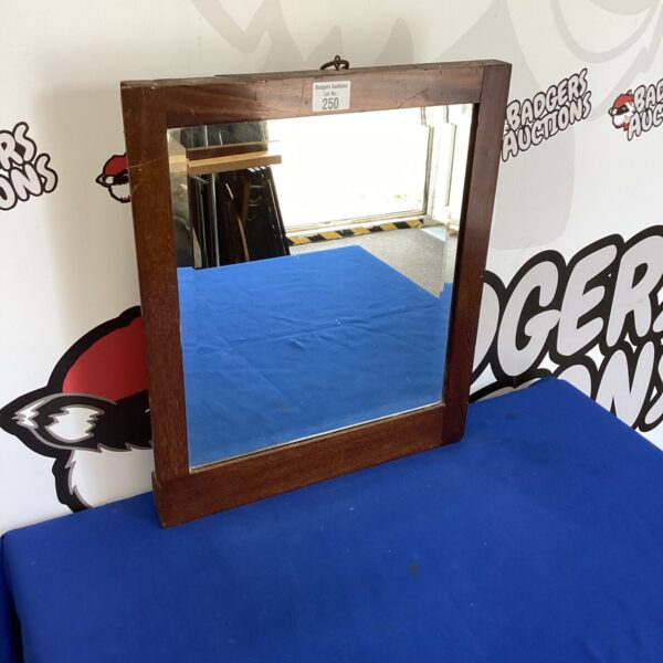 Vintage oak framed bevel edge mirror for wall decor.