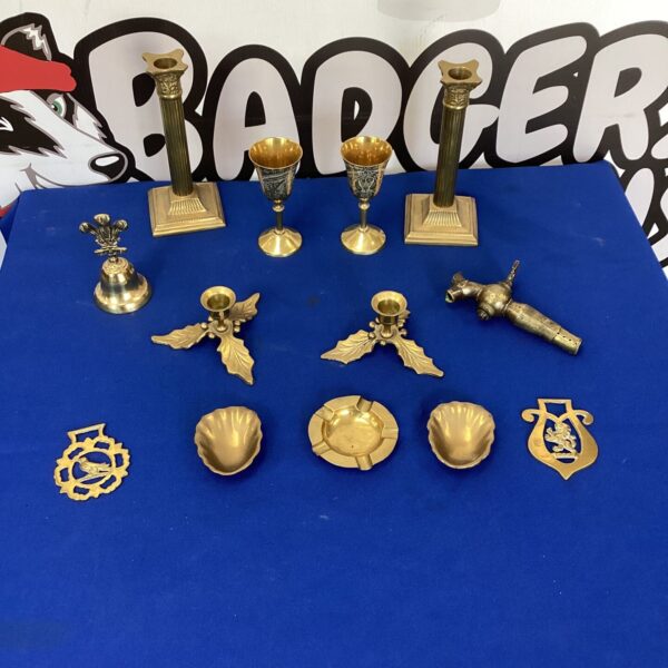 Vintage brass tray with mixed brass candlesticks and ornaments.