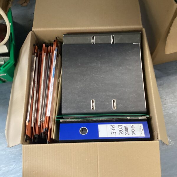 Mixed lot of used ring binders for office organization.