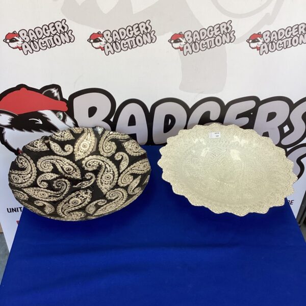Two large decorative glass dishes with embossed patterns.