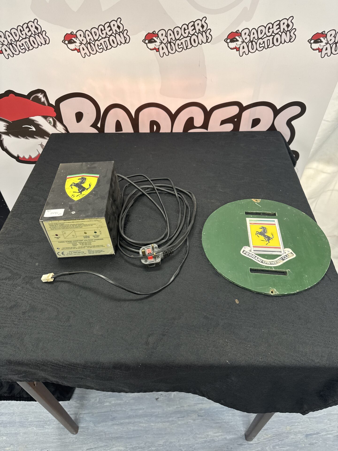 944 L C N projects trickle charger with wooden plaque displaying ferrari owners club sticker