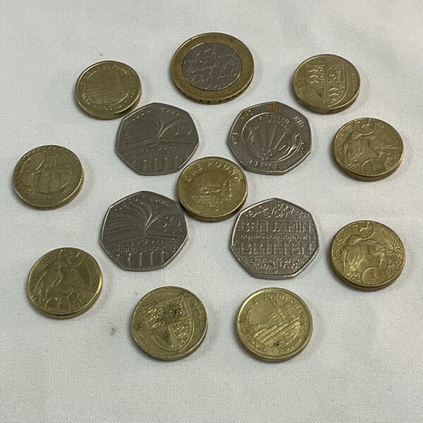 Close-up of a UK coin collection featuring various denominations.