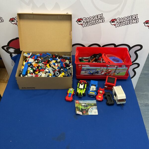 Two boxes filled with a colourful mixed Lego collection.