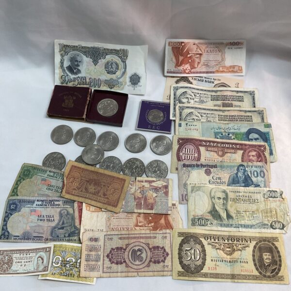 Diverse collection of commemorative banknotes and coins for collectors.