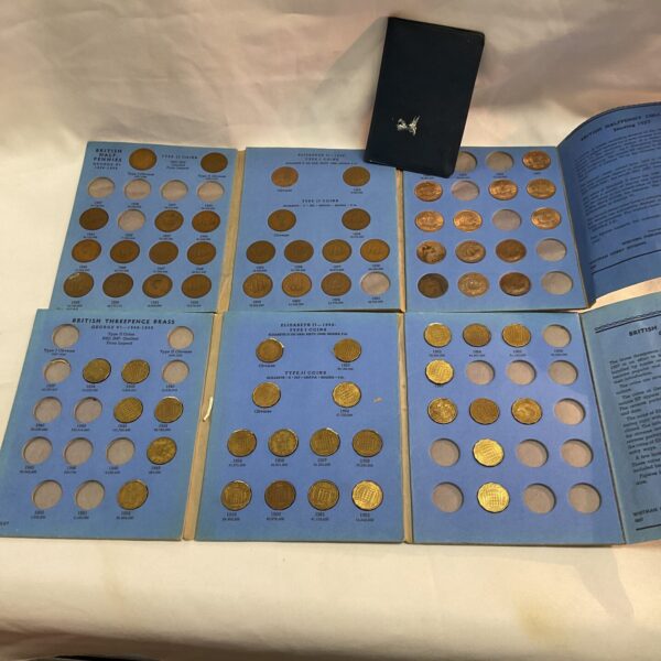 Vintage British coin collectors folder with coins inside.